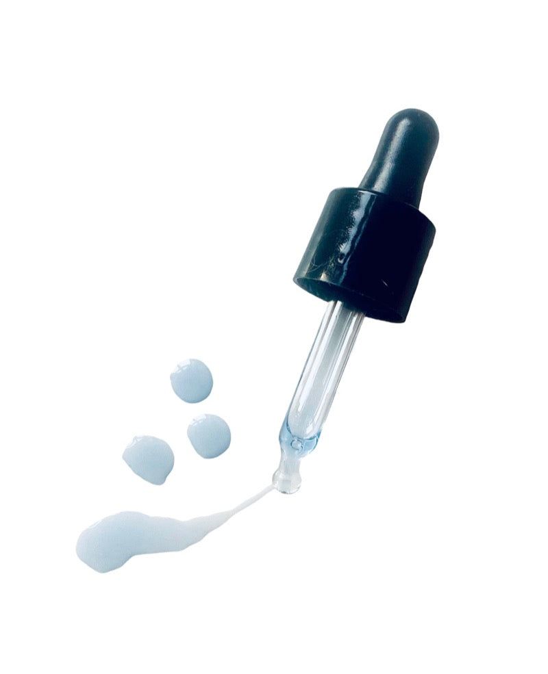 L' Azul Skin Refining Serum with dropper and blue liquid drops on white background.